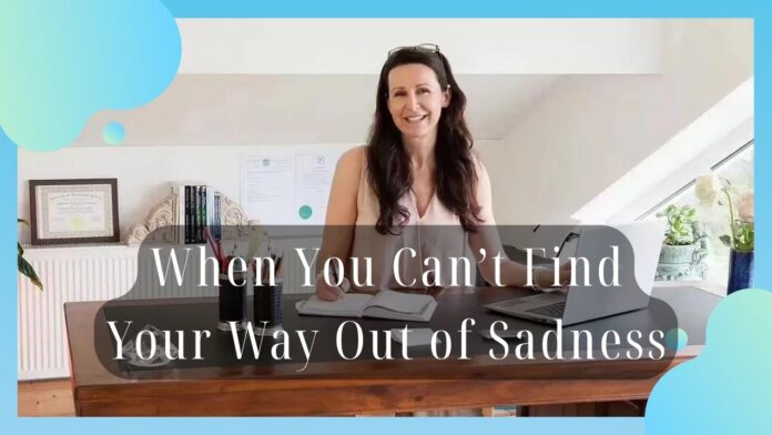 Video thumbnail: smiling woman at a desk with a laptop, overlaid with the caption 'When You Can’t Find Your Way Out of Sadness'.